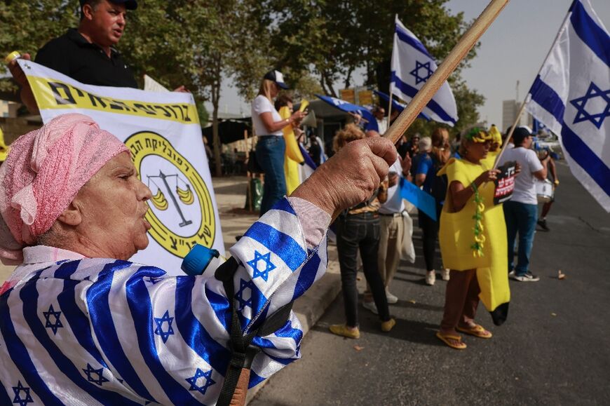 Government backers demonstrate their support for the judicial reforms outside the Israeli Supreme Court as it considers petitions against a key plank