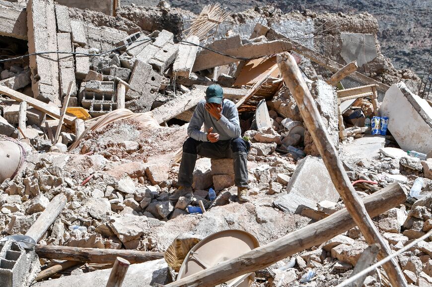 A resident cries amid search operations in the village of Imi N'Tala on September 17, 2023, following the powerful 6.8-magnitude earthquake