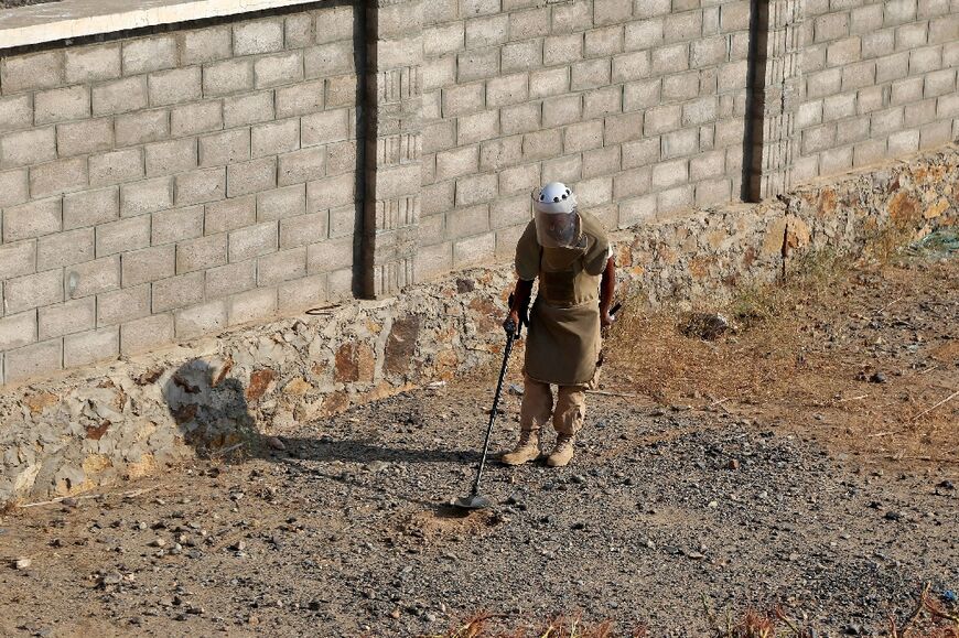 A member of a Yemeni mine disposal team works during an awareness campaign in the Khokha district of the Hodeida province of Yemen, on December 21, 2022