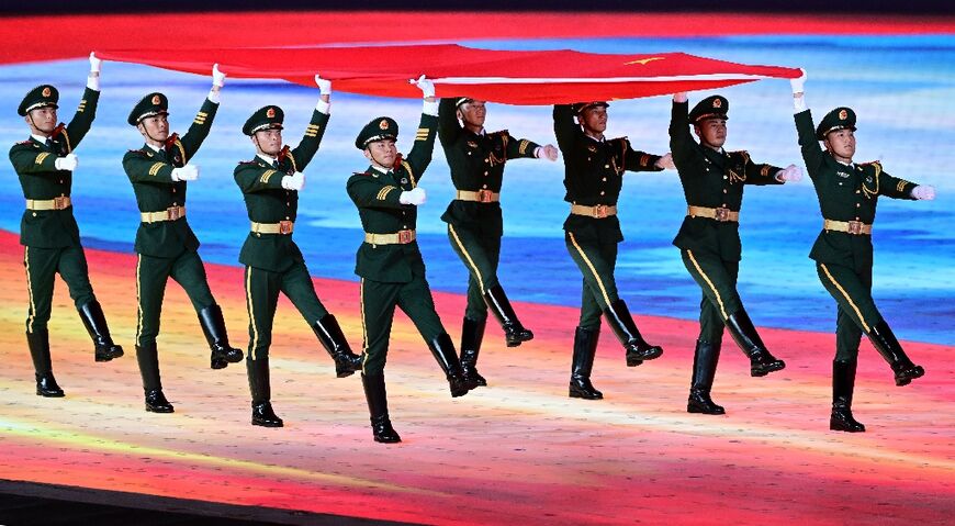 China's national flag is carried during the opening ceremony of the Asian Games 