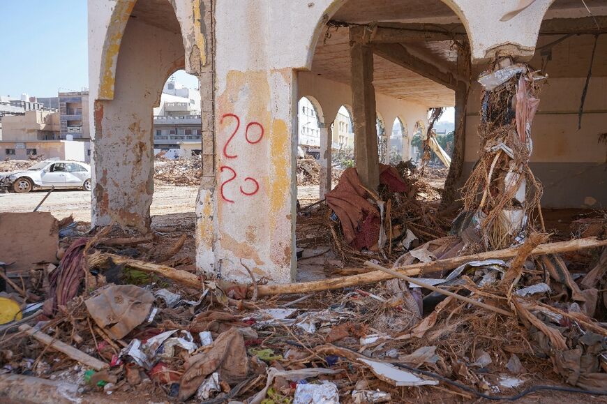 Rubble and debris litter a street in Al-Bayda in the aftermath of the devastating flood