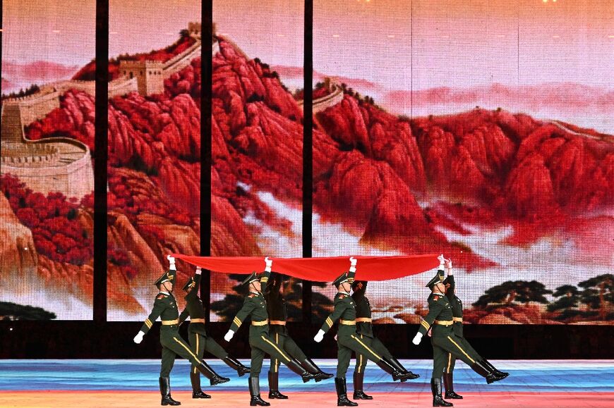 China's national flag is carried during the opening ceremony of the Asian Games