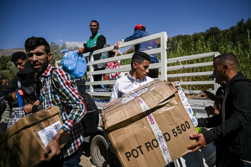 Volunteers distribute relief goods to survivors of Morocco's large quake