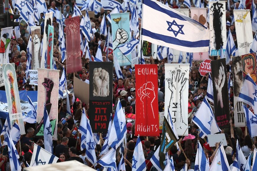 Opponents of the judicial reforms demonstrate outside the Israeli Supreme Court on the eve of its hearing of petitions against the legislation