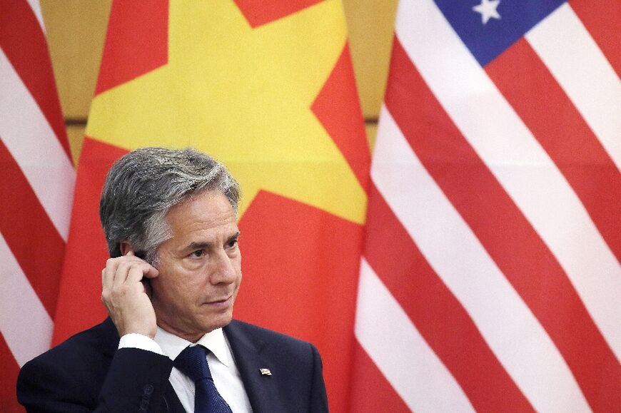 US Secretary of State Antony Blinken, who has signed off on the transfer of Iranian funds frozen in South Korea, listens as US President Joe Biden and Vietnam's Communist Party General Secretary Nguyen Phu Trong speak in Hanoi on September 10, 2023