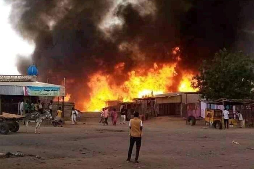 Fire rages at a livestock market area in El Fasher, the capital of Sudan's North Darfur state, on September 1, 2023, in the aftermath of bombardment by the paramilitary Rapid Support Forces (RSF)