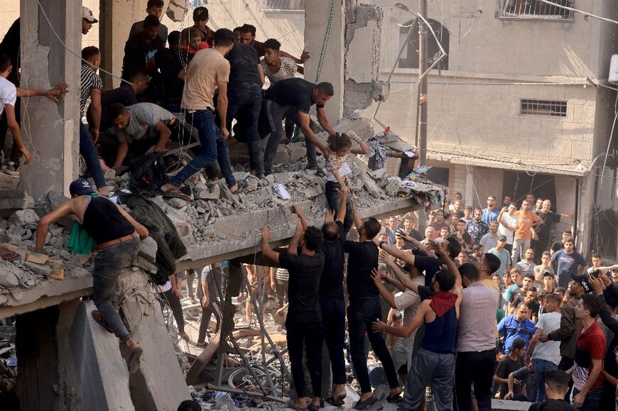 Gazans are struggling to reach people crushed under buildings hit by Israeli air strikes, with many using their bare hands to try and dig them out