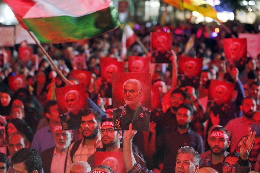 Pictures of slain Revolutionary Guards commander Qasem Soleimani at a rally in Tehran in solidarity with a Hamas offensive against Israel