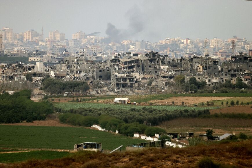 A picture taken from the southern Israeli city of Sderot on October 17, 2023 shows destroyed buildings in the northern Gaza Strip, amid the ongoing battles between Israel and the Palestinian group Hamas