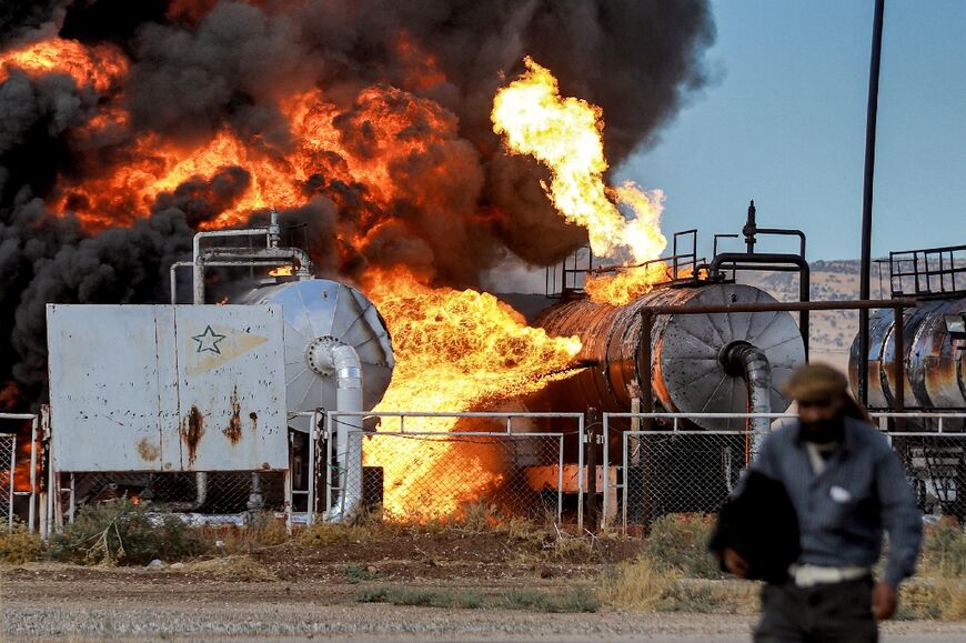 Fire raging at the Zarba oil facility in Qahtaniyeh in northeastern Syria, near the Turkish border after air raids