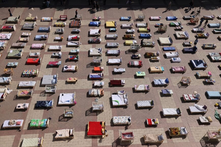 Beds representing the number of Israeli hostages held by Palestinian militants since the October 7 attack, are placed outside the Jerusalem Municipality building in Jerusalem on October 30, 2023, amid the ongoing battles between Israel and the Palestinian group Hamas.