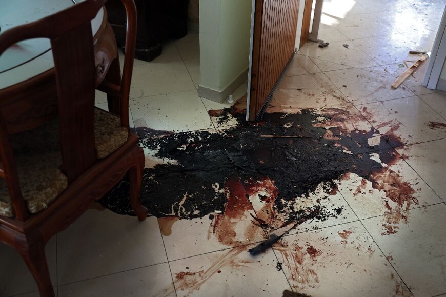 Blood stains cover the floor of a house after the attack by Palestinian Hamas militants on Kibbutz Beeri 