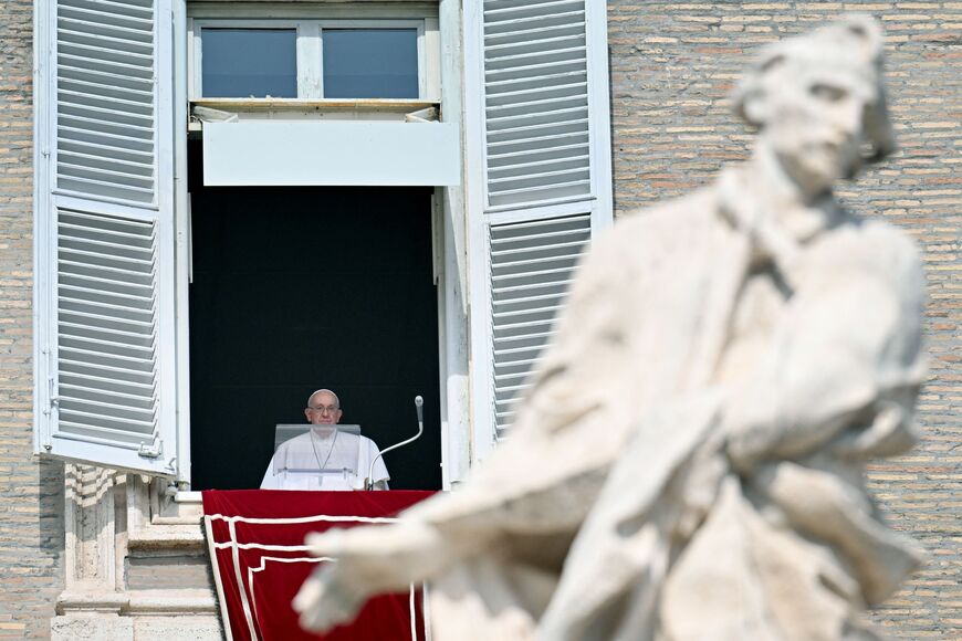 Pope Francis waves to the crowd at the end of the Sunday Angelus prayer in St.Peter's Square at the Vatican on October 15, 2023. Pope Francis called on October 15, 2023 for humanitarian corridors to allow the delivery of essentials to the Gaza Strip, which is under heavy Israeli bombardment following a bloody attack by its rulers, Hamas. (Photo by Alberto PIZZOLI / AFP) (Photo by ALBERTO PIZZOLI/AFP via Getty Images)