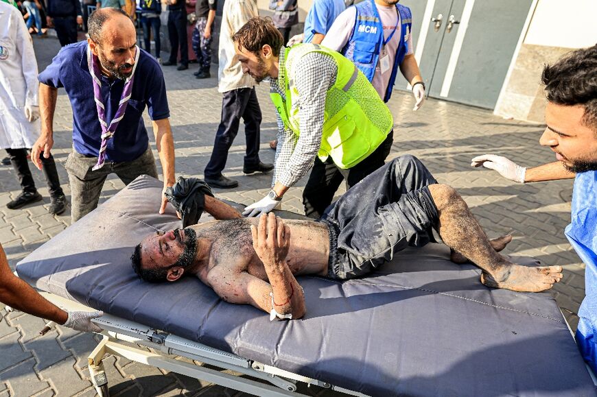 The dead and injured are brought to the al-Shifa hospital in Gaza