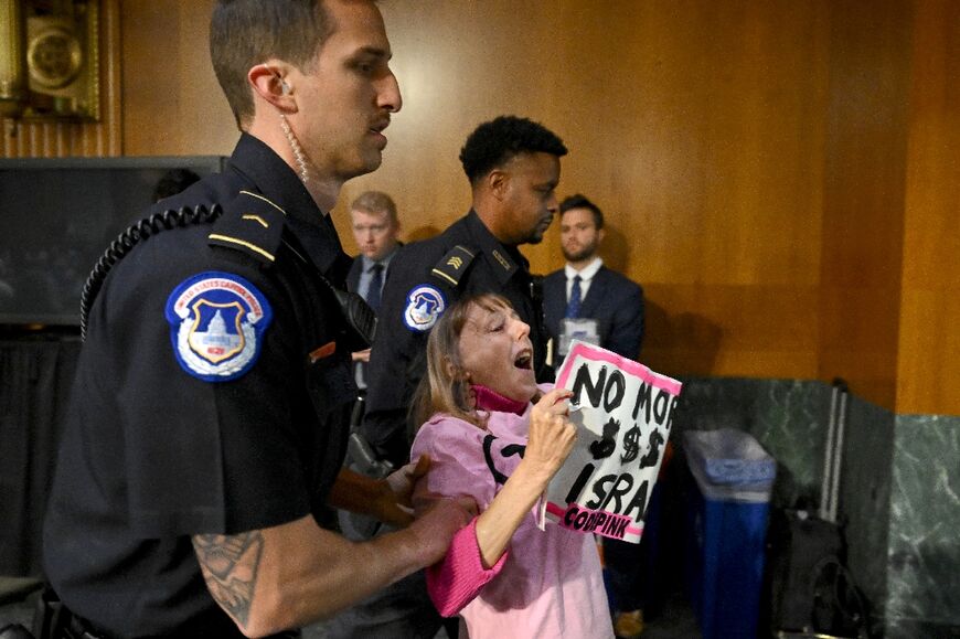 Capitol Police Officers escort Code Pink protestor Medea Benjamin out of the room during a Senate Appropriations Committee hearing to examine the national security supplemental request, on Capitol Hill in Washington, DC, on October 31, 2023