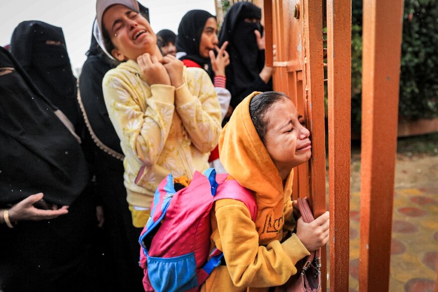 People mourn victims of Israeli bombardment outside Nasser hospital in Khan Yunis in the southern Gaza Strip on November 14, 2023 