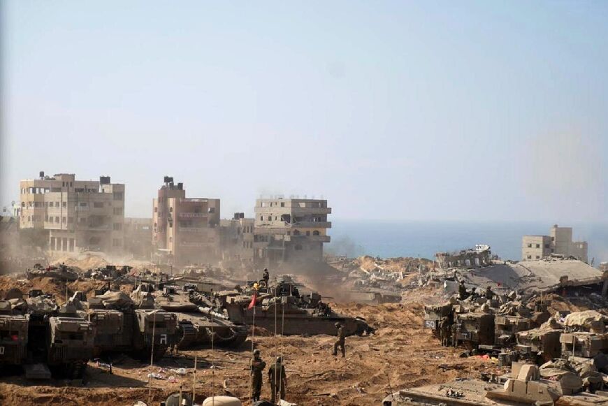 Israeli tanks and soldiers stationed at a location in the northern Gaza Strip