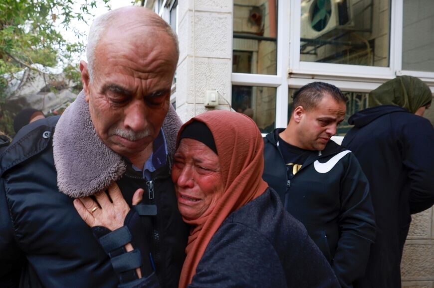 Mourners attend the funeral of Yassin al-Asmar, killed in clashes with Israeli security forces in the West Bank town of Beitunia