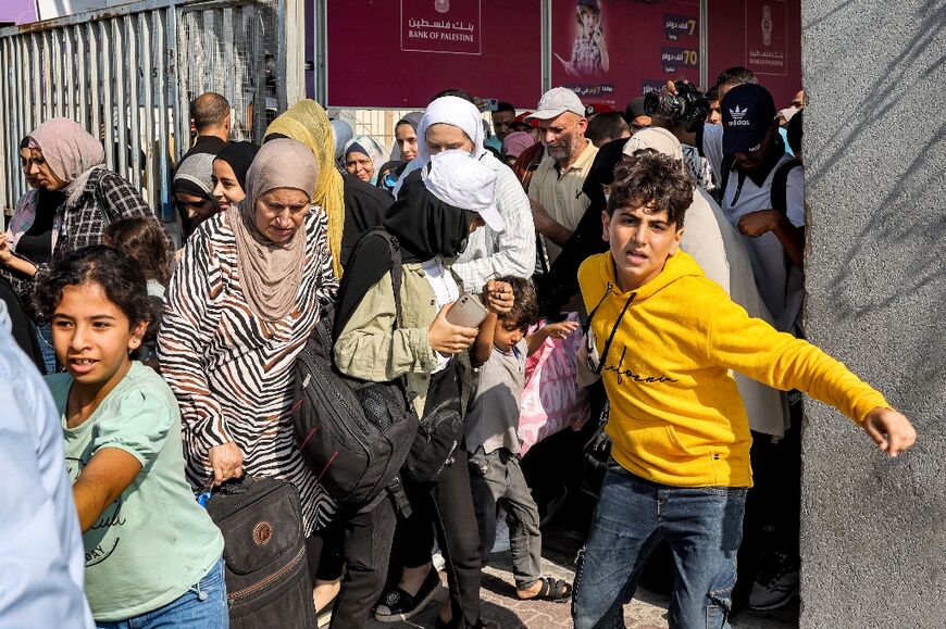 Many Palestinians who also hold foreign passports were allowed to leave war-torn Gaza through the Rafah border crossing with Egypt 