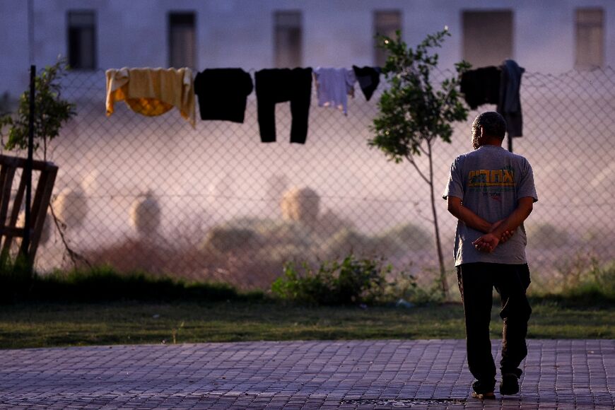 During the day, the workers wander around aimlessly, sleep and follow the bombings