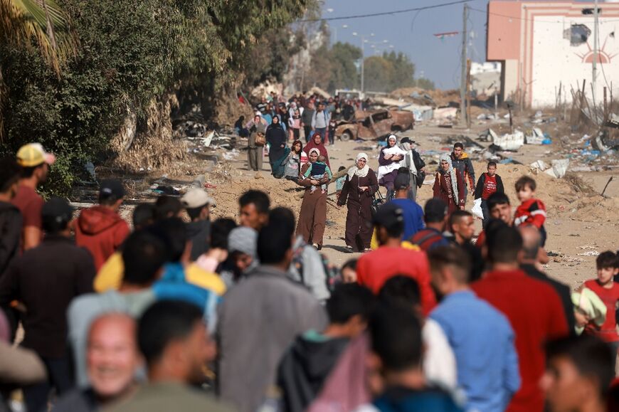 Long lines of fleeing civilians carrying what they can on their backs fill the roads south out of Gaza City