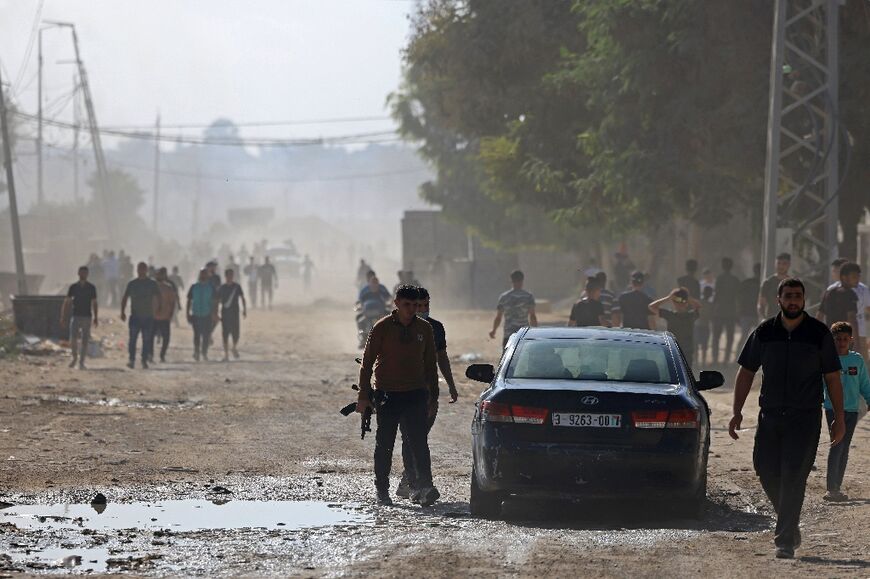 Palestinian militants move towards the Nahal Oz border crossing with Israel, east of Gaza City, in the attack on October 7, 2023