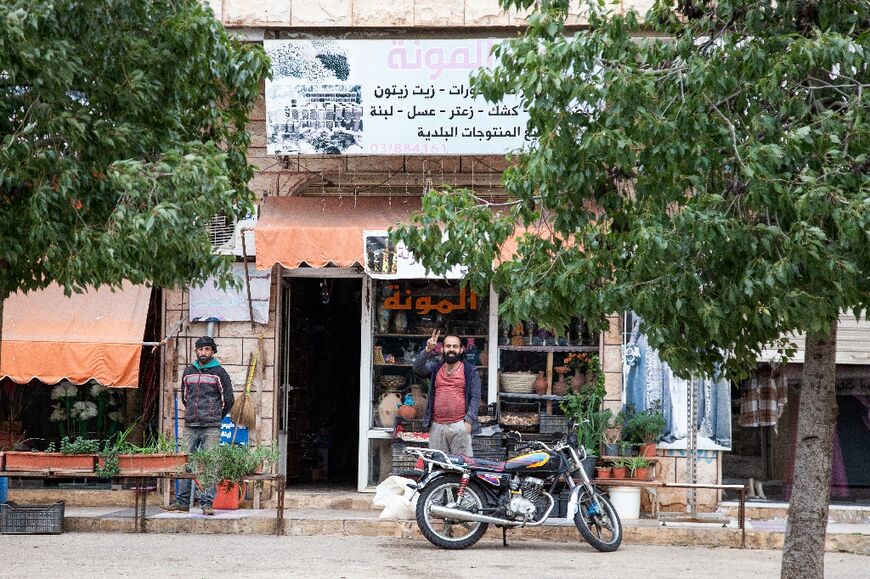 Only a few shops in Kfar Kila remained open after residents fled