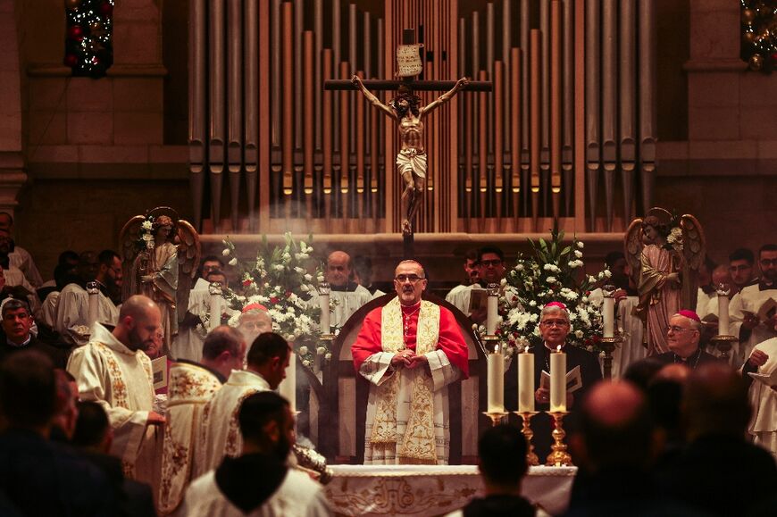 Latin Patriarch of Jerusalem Pierbattista Pizzaballa arrives for Christmas Eve celebrations at the Church of the Nativity in the biblical city of Bethlehem in the occupied West Bank on December 24, 2023