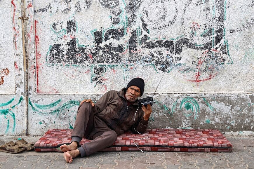 With power and communication cuts, Gazans are returning to time-worn traditions including battery-powered radio sets to get news of the war