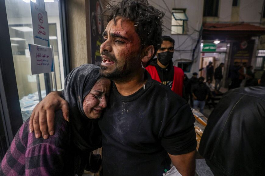 Victims of an Israeli are seen outside the Kuwait hospital in Rafah in the southern Gaza Strip on December 28, 2023