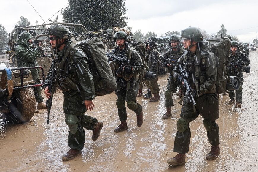 Israeli soldiers prepare to enter the Gaza Strip, near the border area in southern Israel