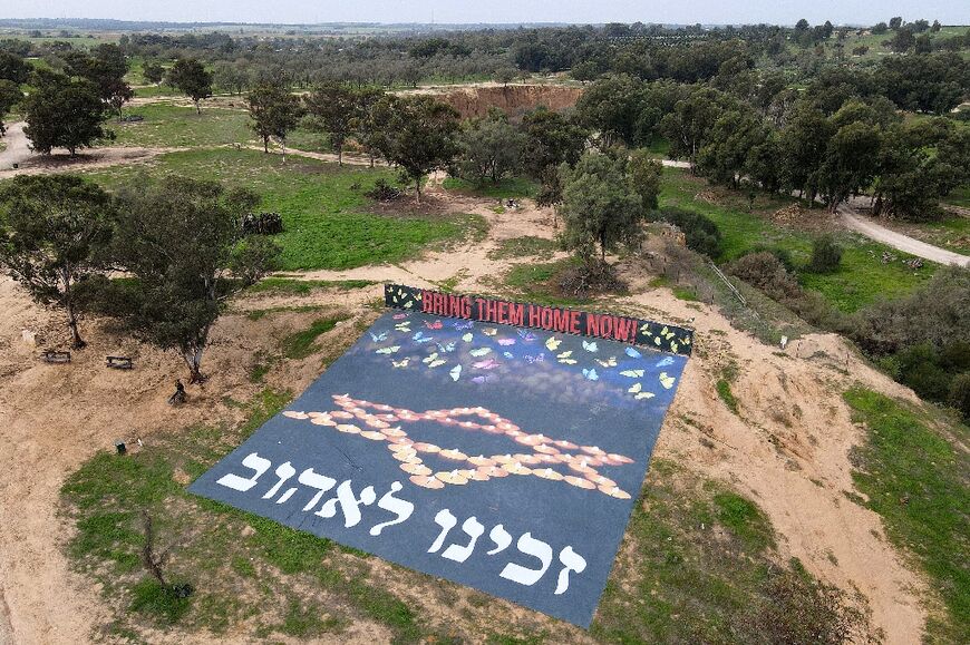 A banner in Hebrew reads, 'It was an honour to love you', at the site of the Supernova festival in Reim, near the Gaza border, where militants killed 364 people according to Israeli data