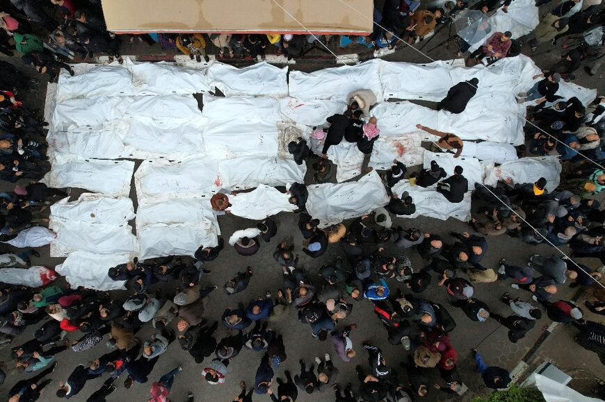 An aerial view of a mass funeral for the strike victims, at Al-Aqsa hospital in Deir Al-Balah, central Gaza