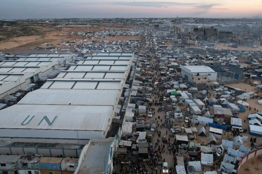 Gazans fleeing Khan Yunis have packed themselves around UN warehouses in Rafah 