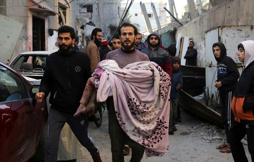 Palestinians were inspecting the damage on Saturday following an Israeli strike on the Zawayda area of the central Gaza Strip.