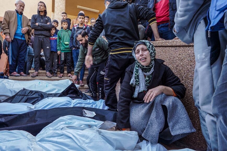 Mourners at Khan Yunis's Nasser hospital on December 9