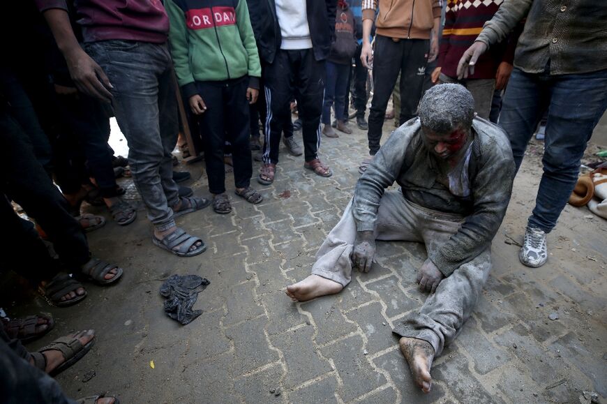 A survivor pulled from the rubble of after Israeli strikes on al-Maghazi refugee camp 