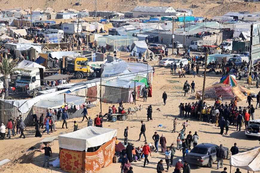 Makeshift tents have sprung up in the sandy wasteland at Rafah