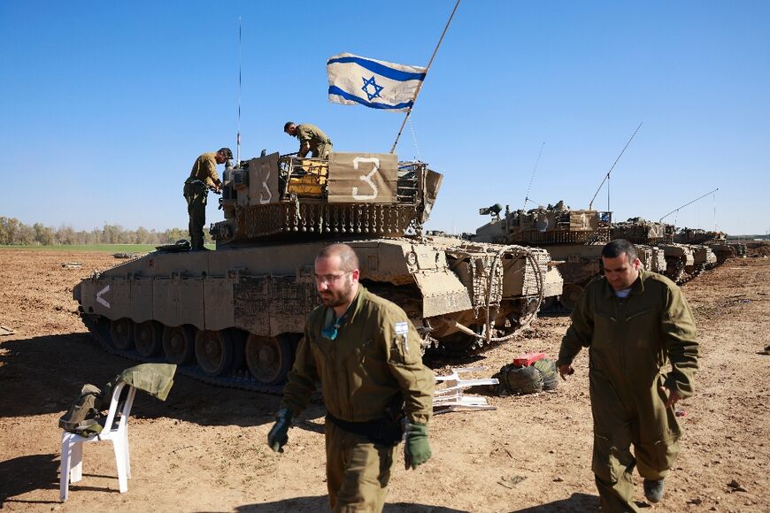 Israeli soldiers at a position on the border with the Gaza Strip on January 7, 2024, amid ongoing battles between Israel and Hamas militants