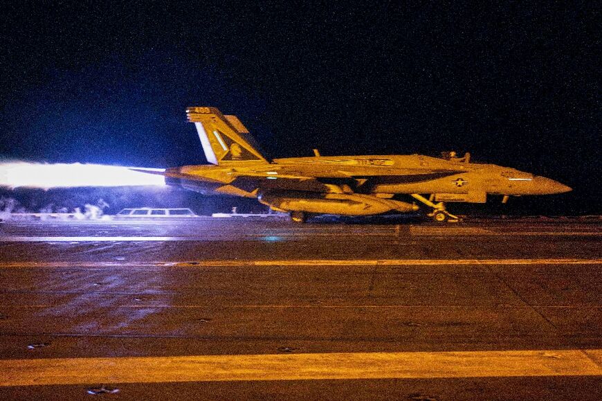 A fighter jet takes off from USS Dwight D. Eisenhower during operations in response to Huthi attacks