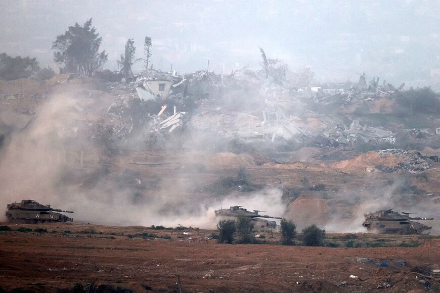 Israeli tanks roll through the central Gaza Strip on Tuesday