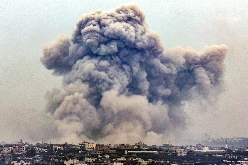 Seen from Rafah, smoke billows over Khan Yunis in the southern Gaza strip during Israeli bombardment 