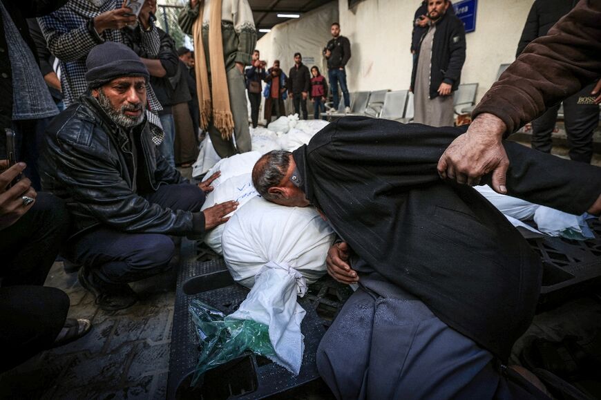 Palestinians in Rafah mourn over victims of the latest Israeli bombardment 