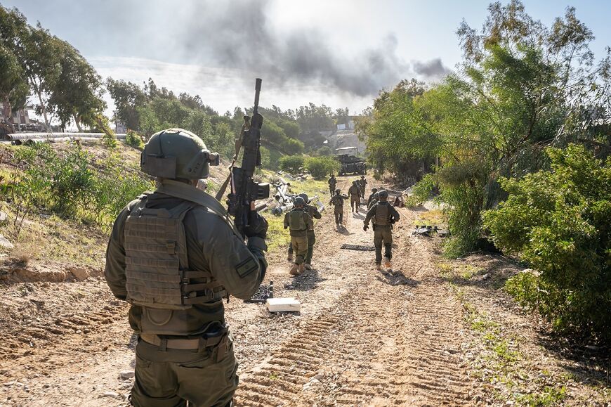 A handout picture released by the Israeli army on January 26, 2024 shows Israeli soldiers operating in the Gaza Strip 