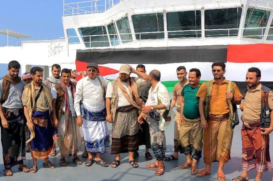 The Huthi's minister of information, Dhaifallah Al-Shami, inspects the Galaxy Leader Cargo ship two days after it was seized