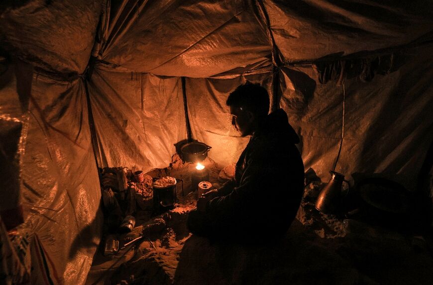 Firewood is scarce and expensive in Gaza, so those displaced by the fighting are forced to burn plastic waste for heat