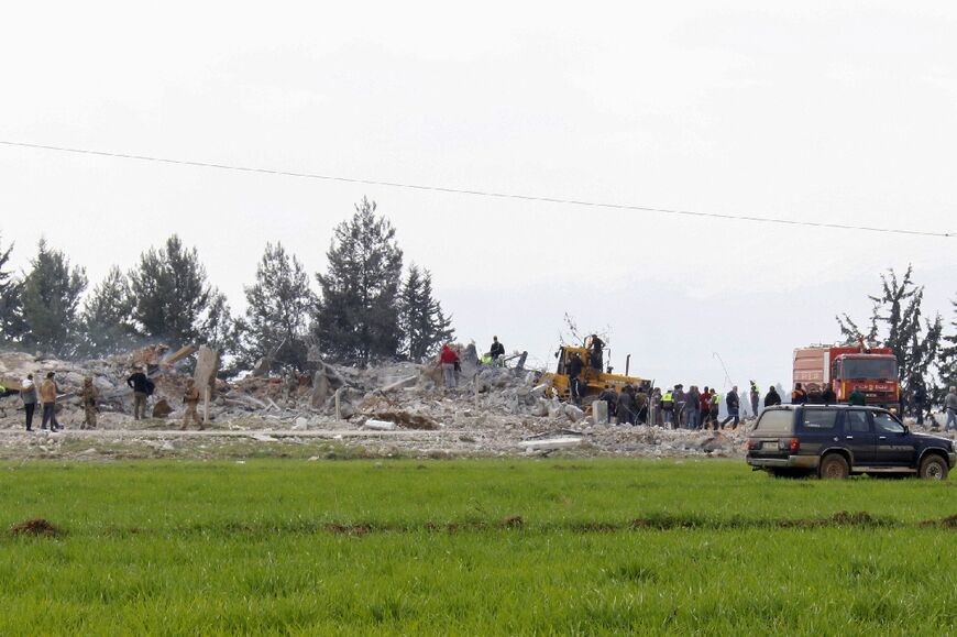 Lebanese soldiers and emergency service personnel inspect the site of the Israeli strike near Baalbek