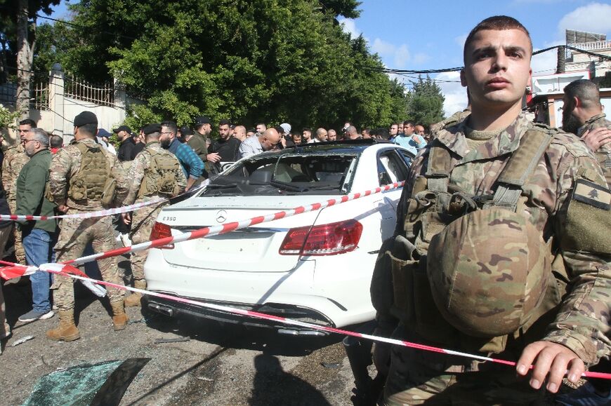 Lebanese soldiers secure the area after a reported Israeli drone strike in the village of Jadra