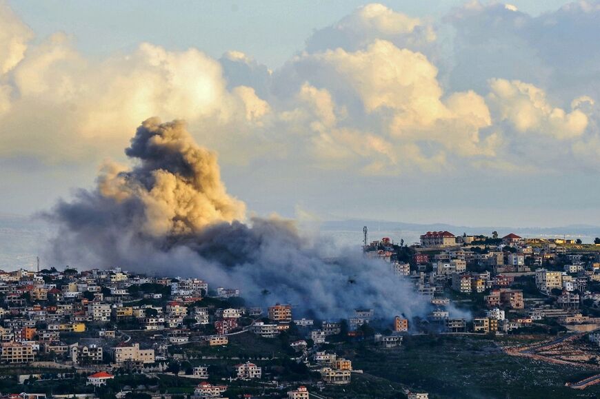 Smoke billows over the south Lebanon town of Al-Khiam following a reported Israeli air strike