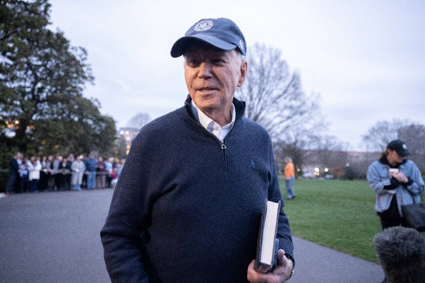 US President Joe Biden speaks to the press before he departs the White House in Washington, DC, for the presidential retreat in Camp David, Maryland